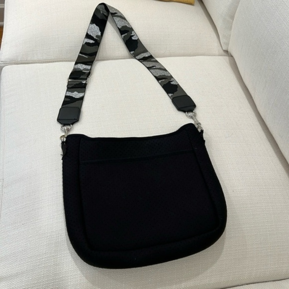 Black bag with camo strap